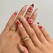 Crimson Bloom Compass Long Almond press-on nails, modeled detail view 1