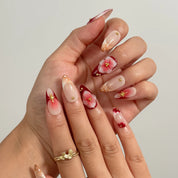 Crimson Bloom Compass Long Almond press-on nails, modeled detail view 2