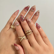 Rosewood Garden Glow Long Almond press-on nails, modeled detail view 1