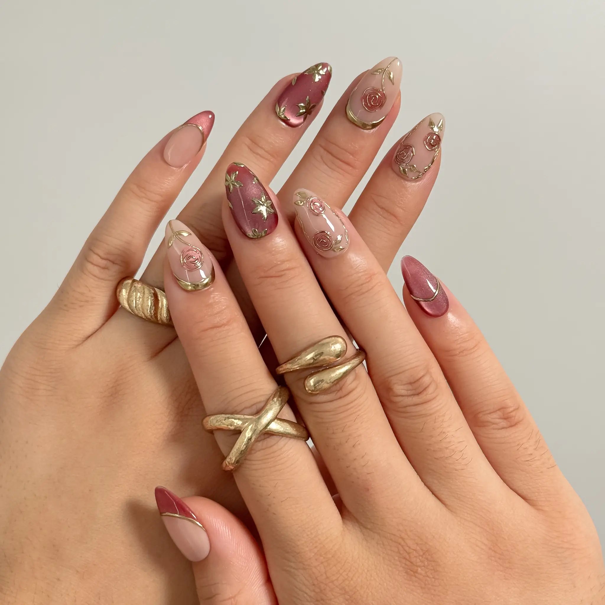 Rosewood Garden Glow Long Almond press-on nails, modeled detail view 1