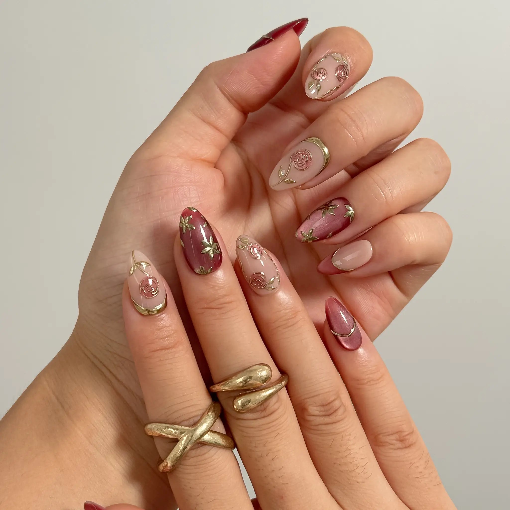 Rosewood Garden Glow Long Almond press-on nails, modeled detail view 2
