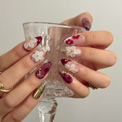 Burgundy Petal Heirloom Long Almond press-on nails, modeled detail view 2