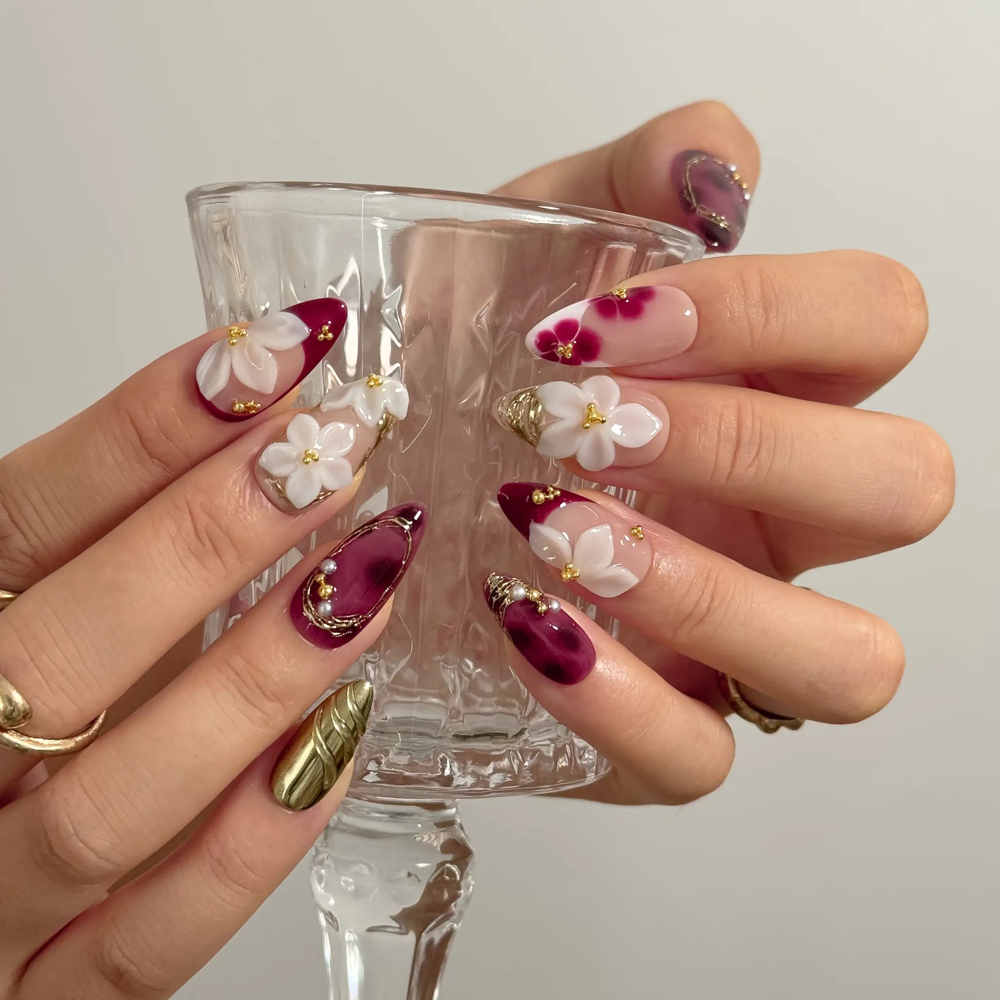 Burgundy Petal Heirloom Long Almond press-on nails, modeled detail view 2