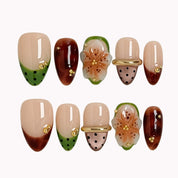 Orchard Truffle Bloom press-on nails in Nude, Green, Brown, Gold on a white background
