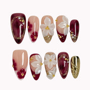 Burgundy Petal Heirloom press-on nails in Nude, Red, White, Gold on a white background