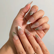Pearl Star Bow Long Almond press-on nails, modeled detail view 1