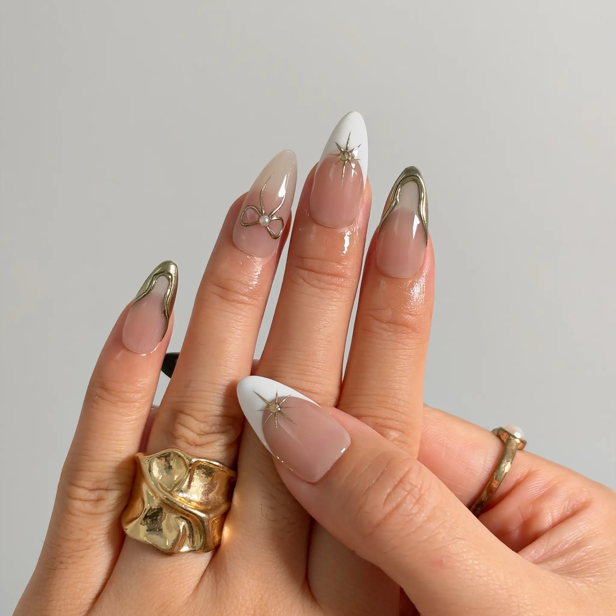 Pearl Star Bow Long Almond press-on nails, modeled detail view 2