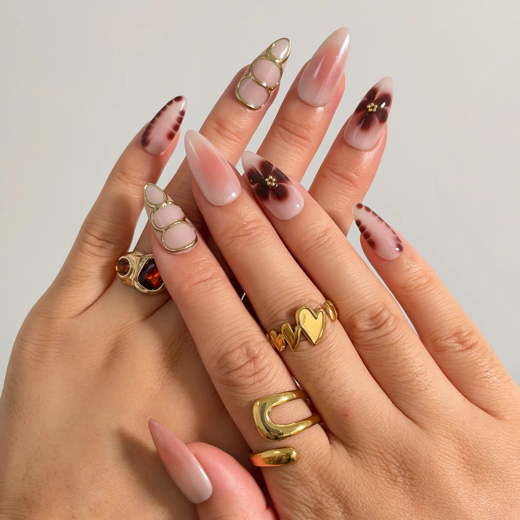 Mocha Petal Gilding press-on nails shown on hand