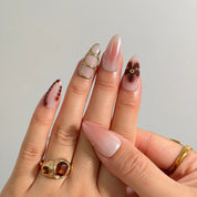 Mocha Petal Gilding Long Almond press-on nails, modeled detail view 2