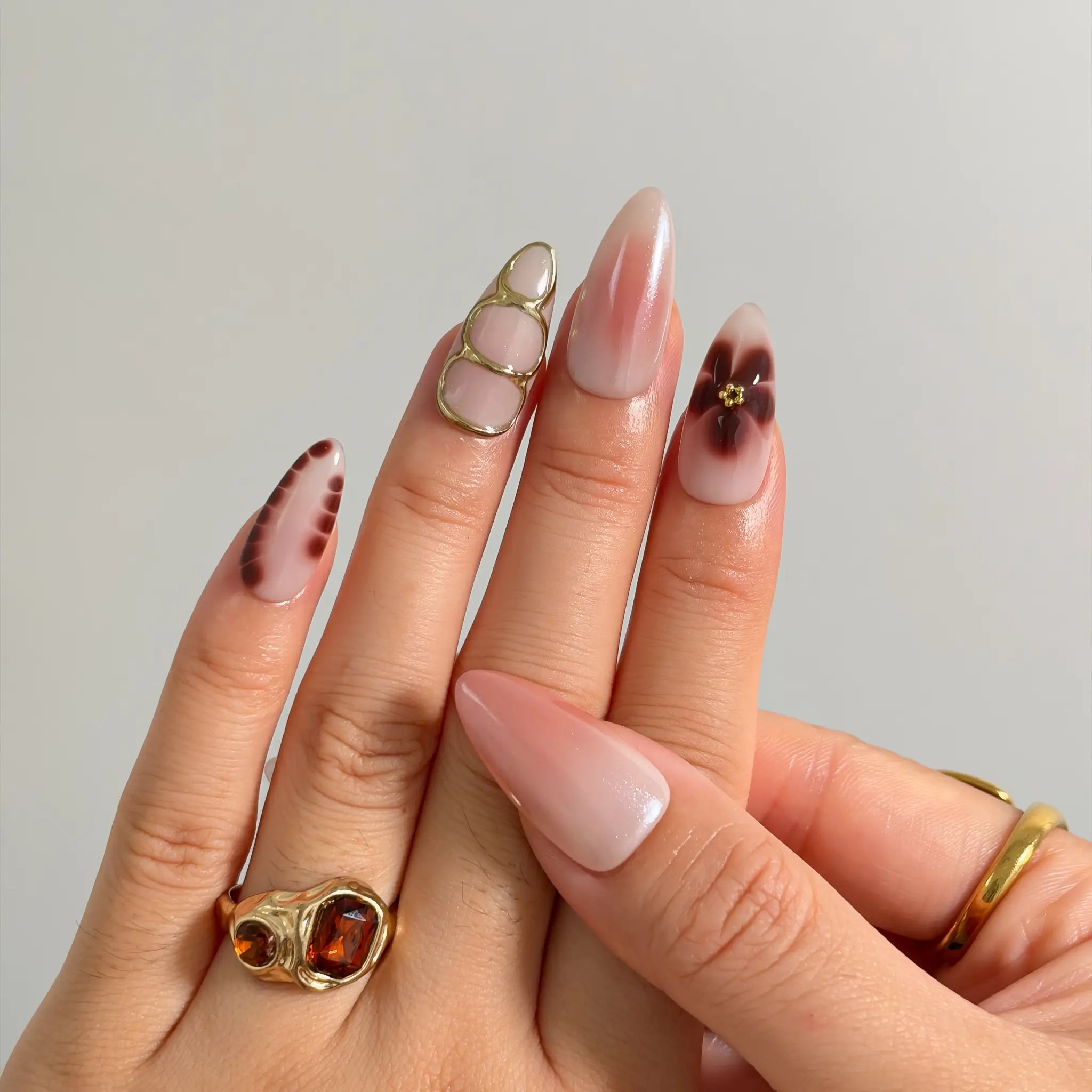 Mocha Petal Gilding Long Almond press-on nails, modeled detail view 2