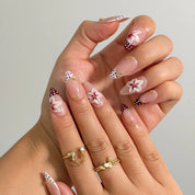 Poinsettia Dot Noel Long Almond press-on nails, modeled detail view 1