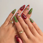 Jewel Tree Cheer press-on nails shown on hand