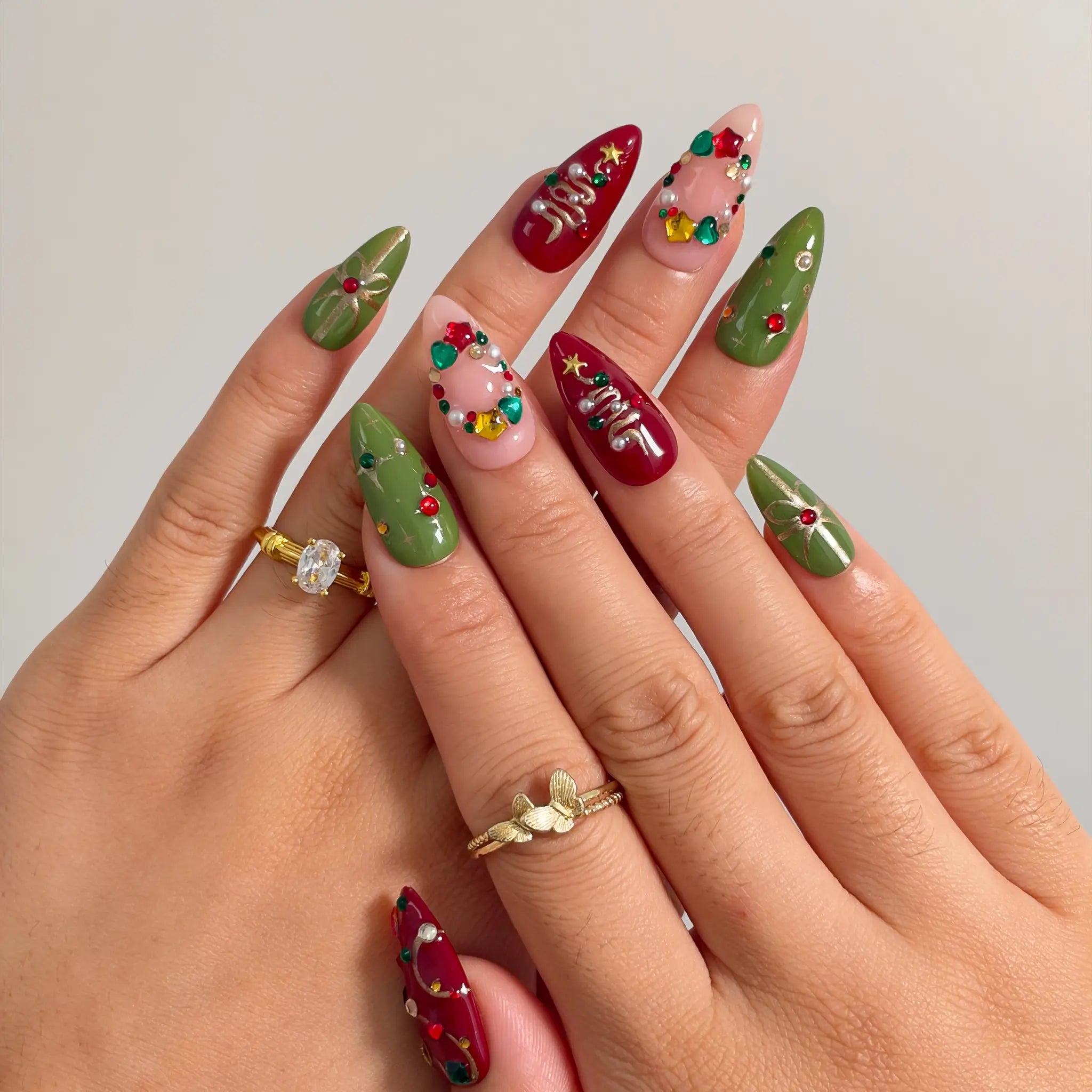 Jewel Tree Cheer press-on nails shown on hand