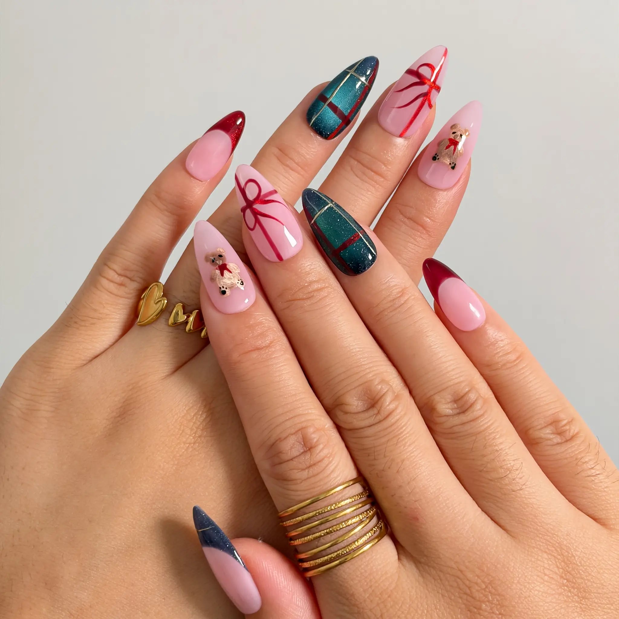 Teddy Gift Gala press-on nails shown on hand