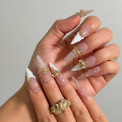 Ivory Baroque Halo Long Almond press-on nails, modeled detail view 1