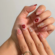 Rose Garden Gilded Long Almond press-on nails, modeled detail view 1