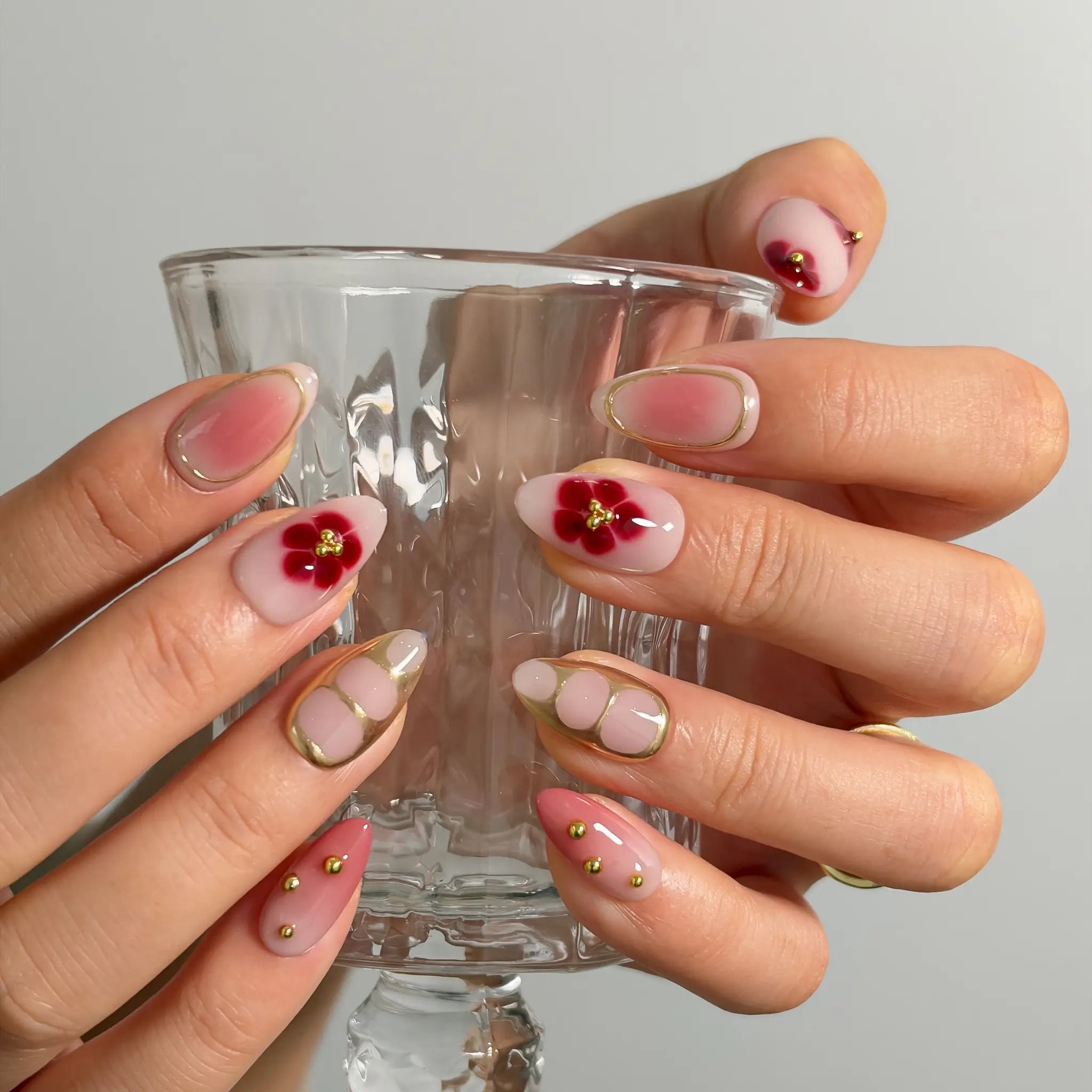 Rose Garden Gilded Long Almond press-on nails, modeled detail view 2