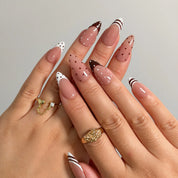 Cocoa Dot French press-on nails shown on hand