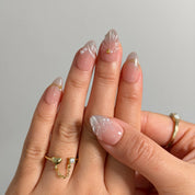 Pearl Shell Whisper Long Almond press-on nails, modeled detail view 2