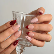 Burgundy Dot Reverie Long Almond press-on nails, modeled detail view 2