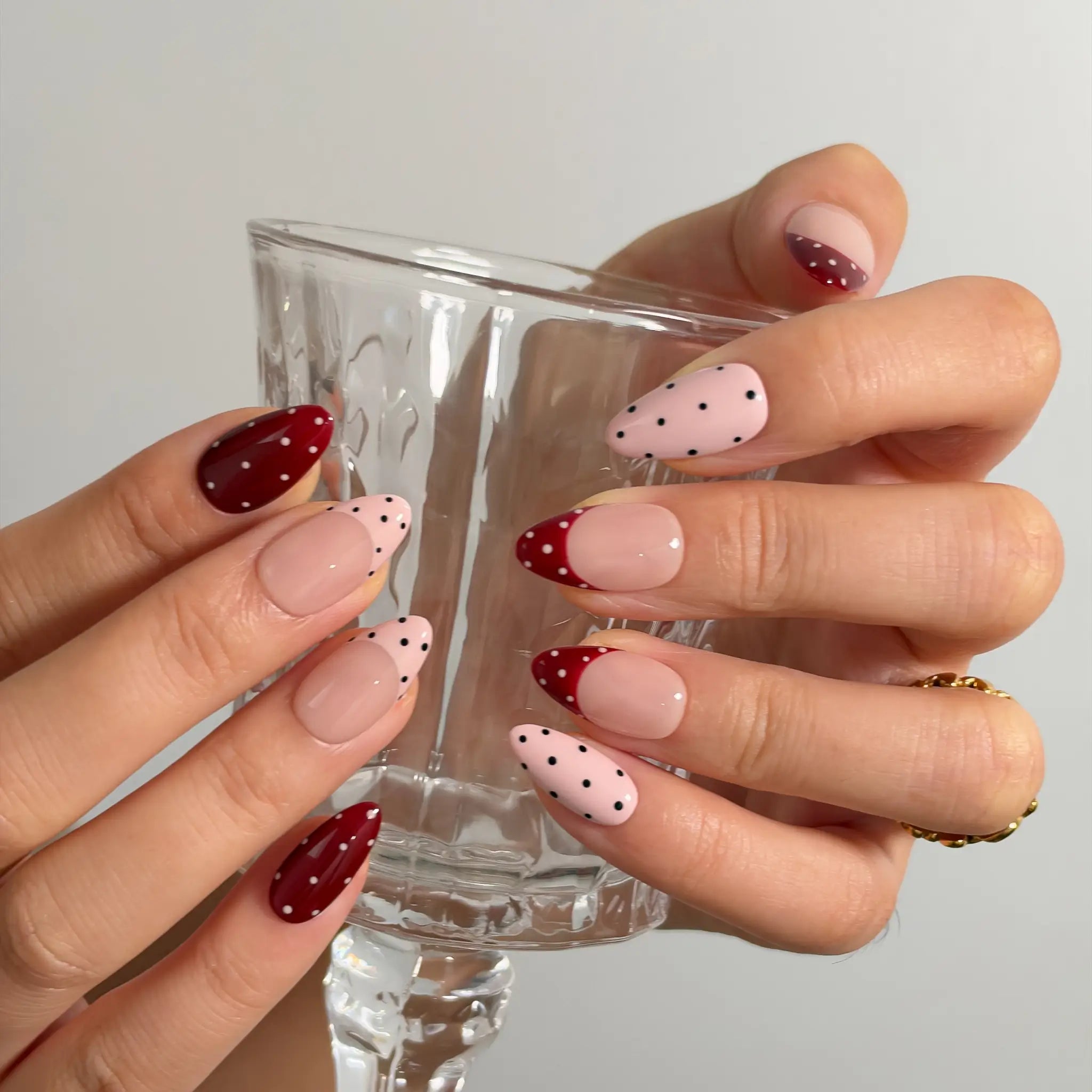 Burgundy Dot Reverie Long Almond press-on nails, modeled detail view 2