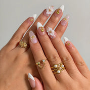 Pearl Blossom Whisper press-on nails shown on hand