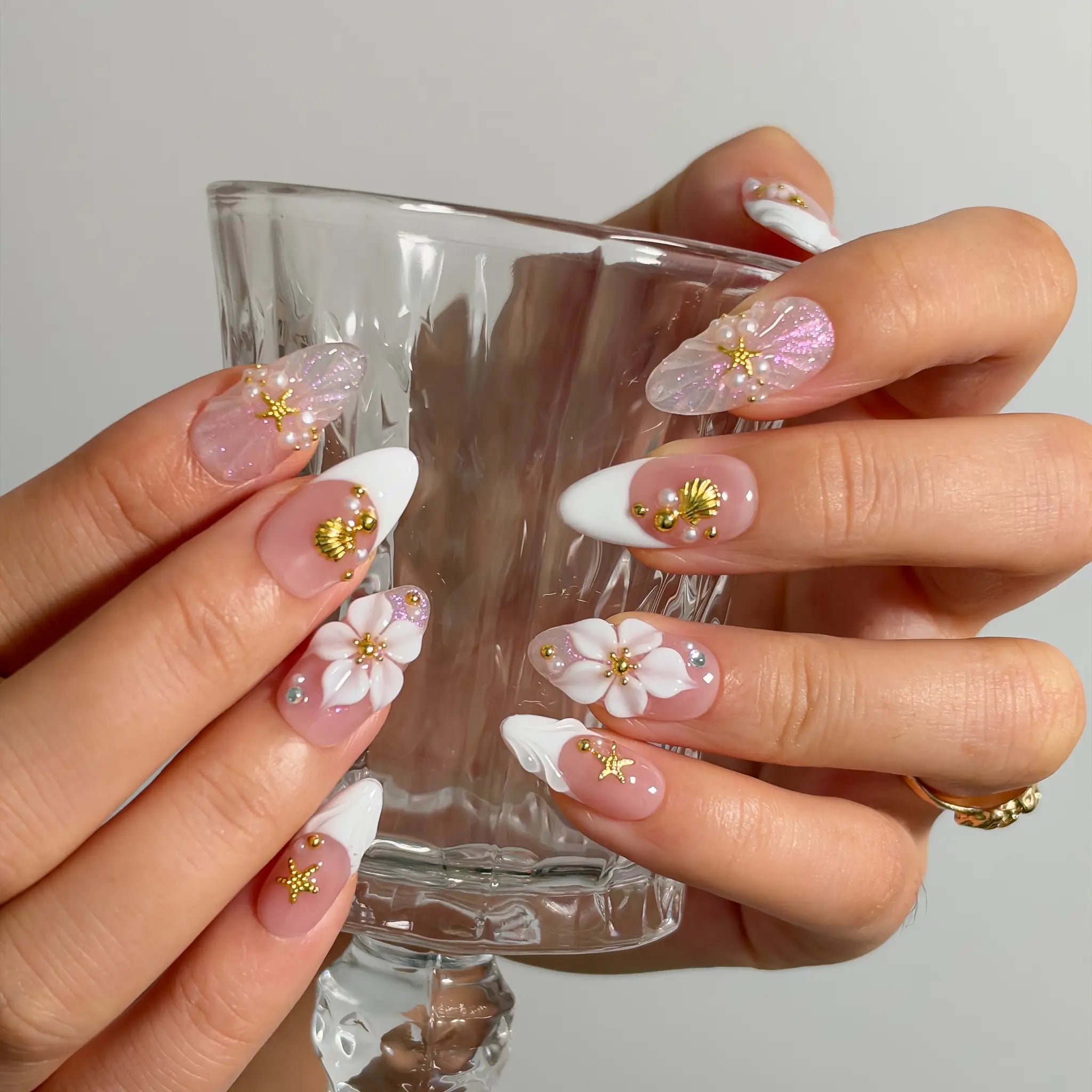 Pearl Blossom Whisper Long Almond press-on nails, modeled detail view 3