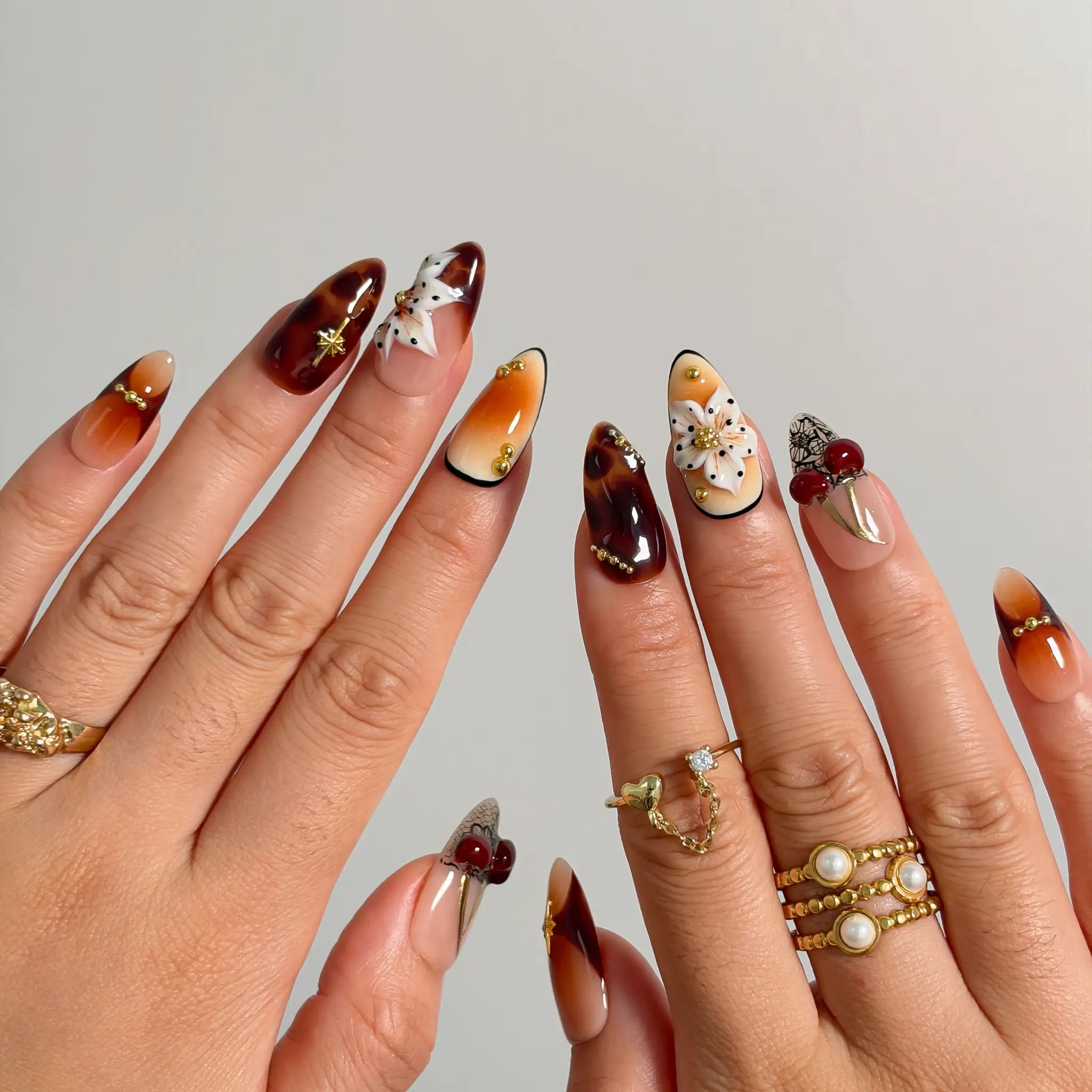 Amber Botanical Heirloom Long Almond press-on nails, modeled detail view 2