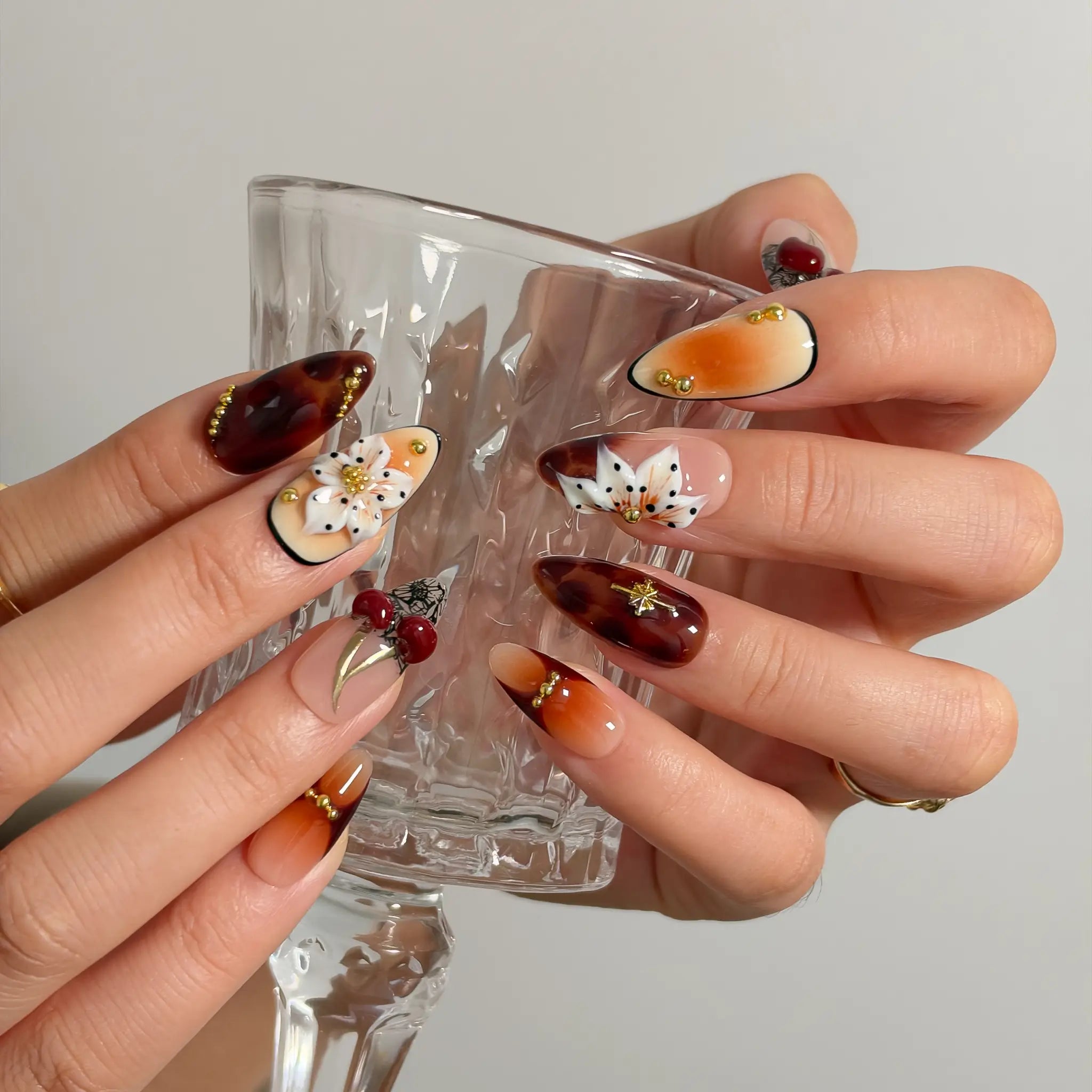 Amber Botanical Heirloom Long Almond press-on nails, modeled detail view 3