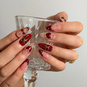 Cherry Ribbon Gala Long Almond press-on nails, modeled detail view 2