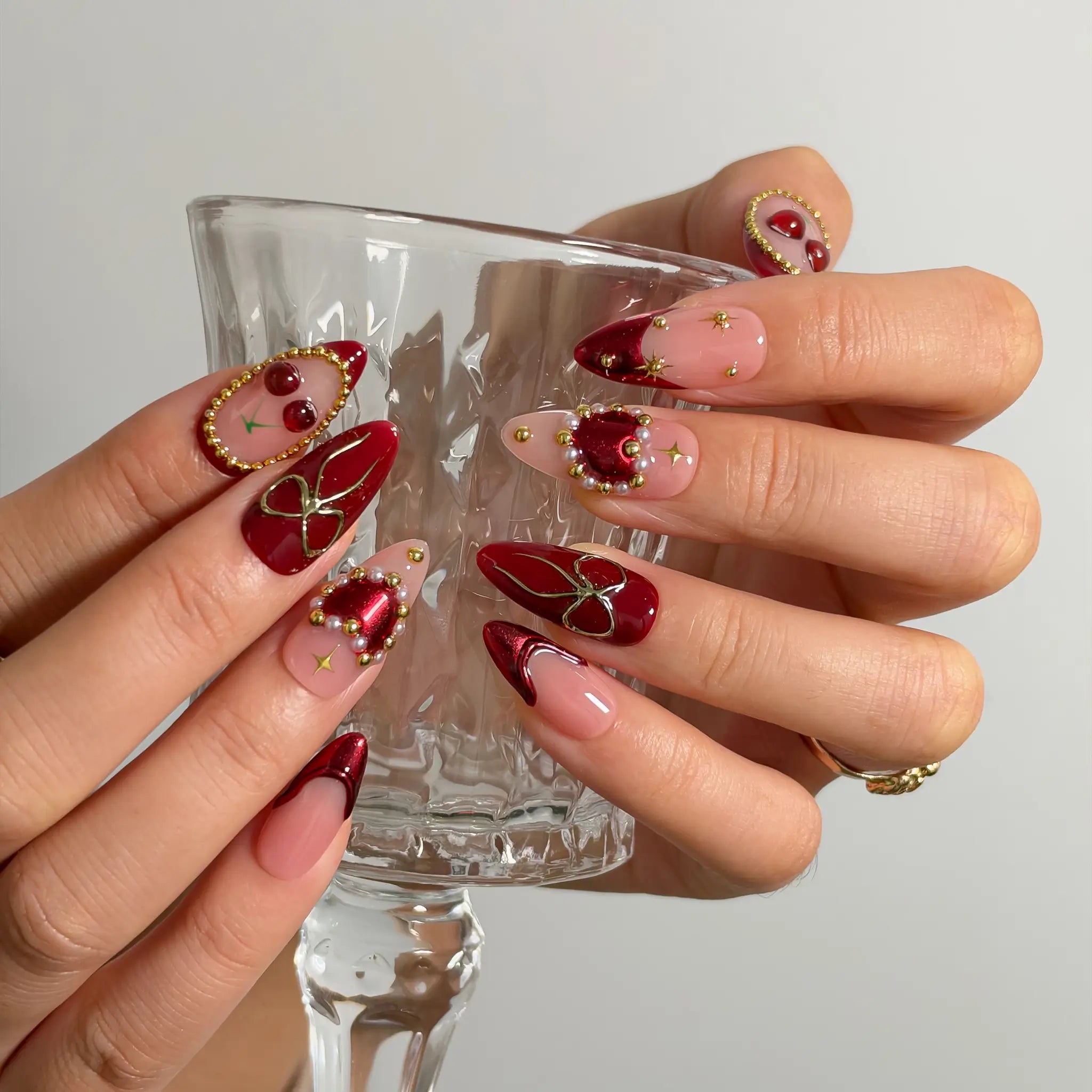 Cherry Ribbon Gala Long Almond press-on nails, modeled detail view 2