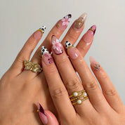 Burgundy Wildflower Muse press-on nails shown on hand