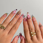 Burgundy Wildflower Muse Long Almond press-on nails, modeled detail view 2