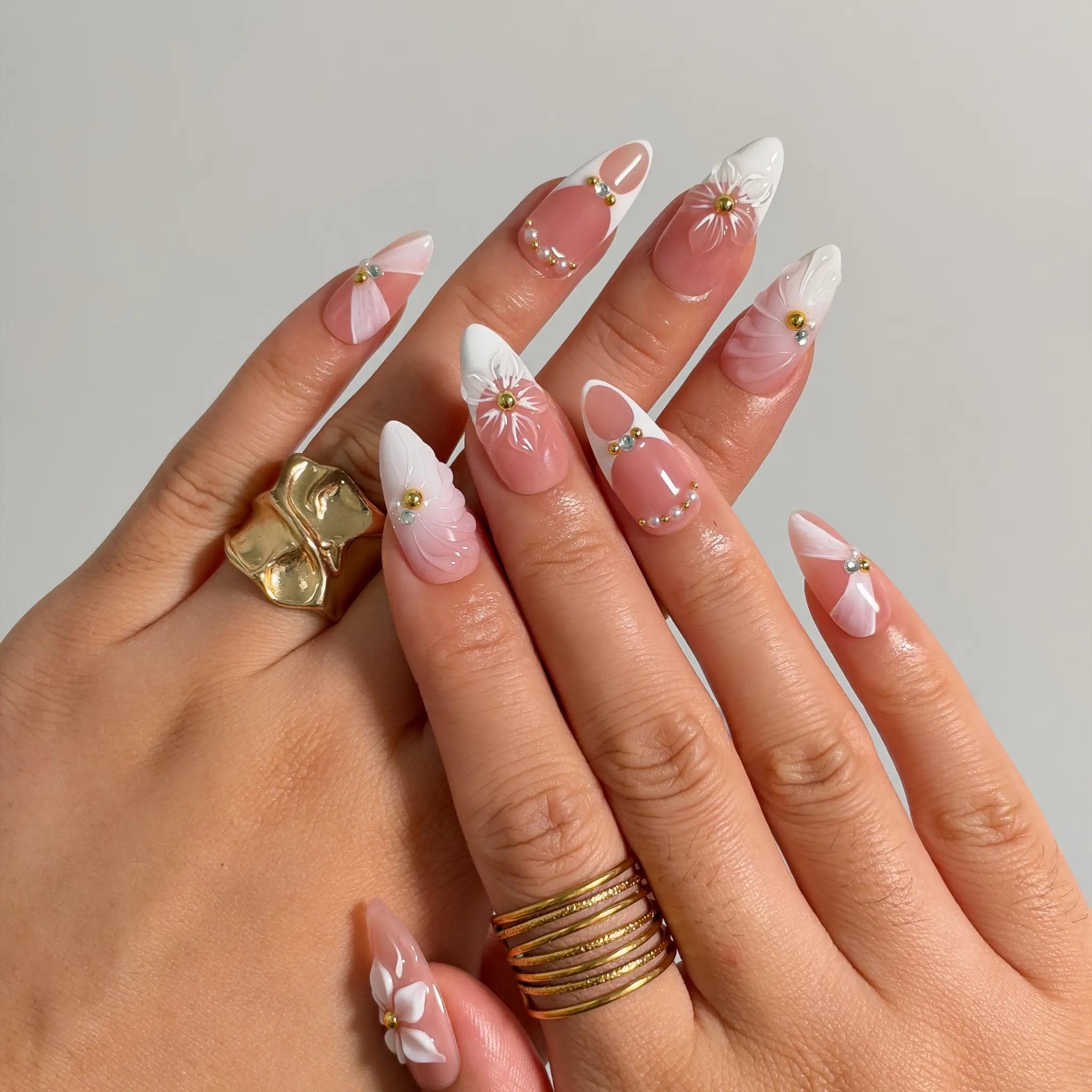 Ivory Petal Reverie press-on nails shown on hand