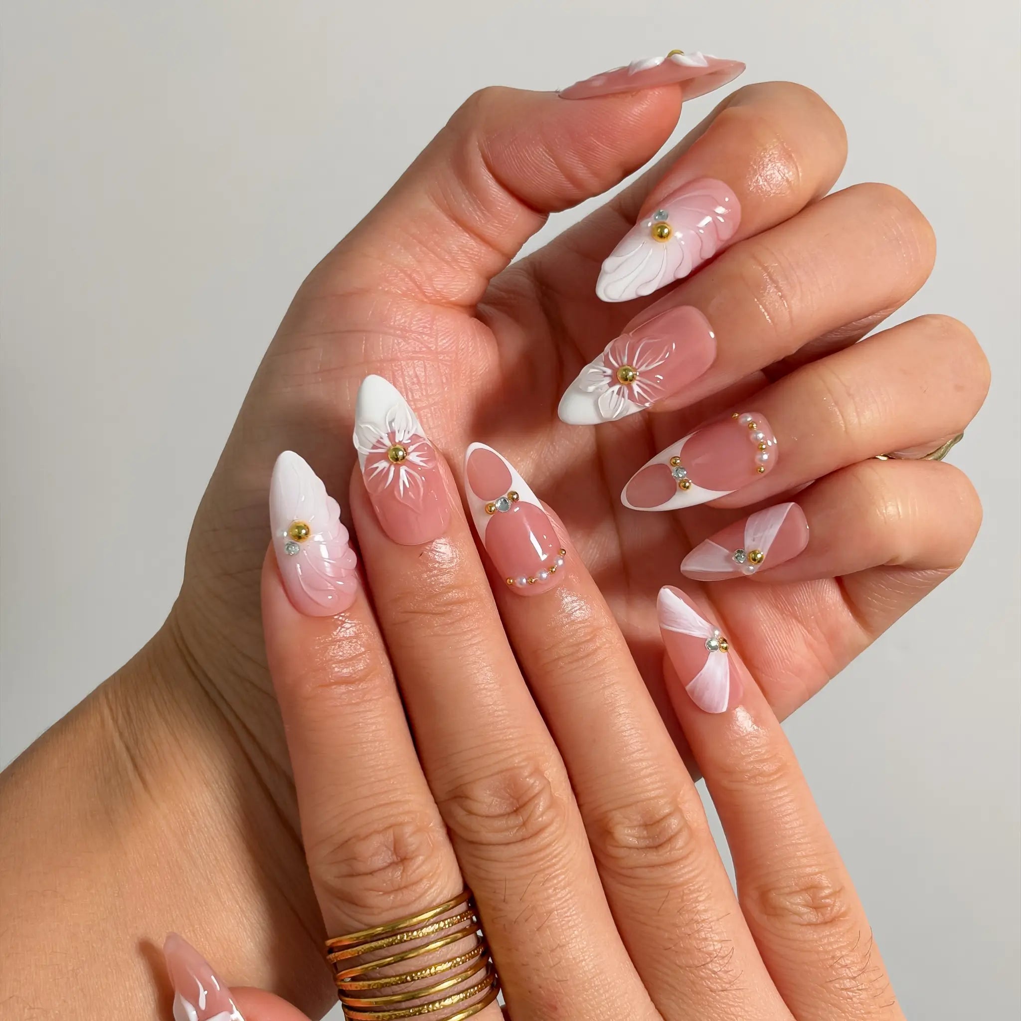 Ivory Petal Reverie Long Almond press-on nails, modeled detail view 1