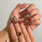 Mocha Gilded Relic Long Almond press-on nails, modeled detail view 1