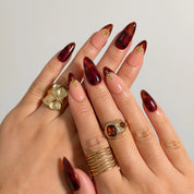 Tortoiseshell Golden Ember press-on nails shown on hand