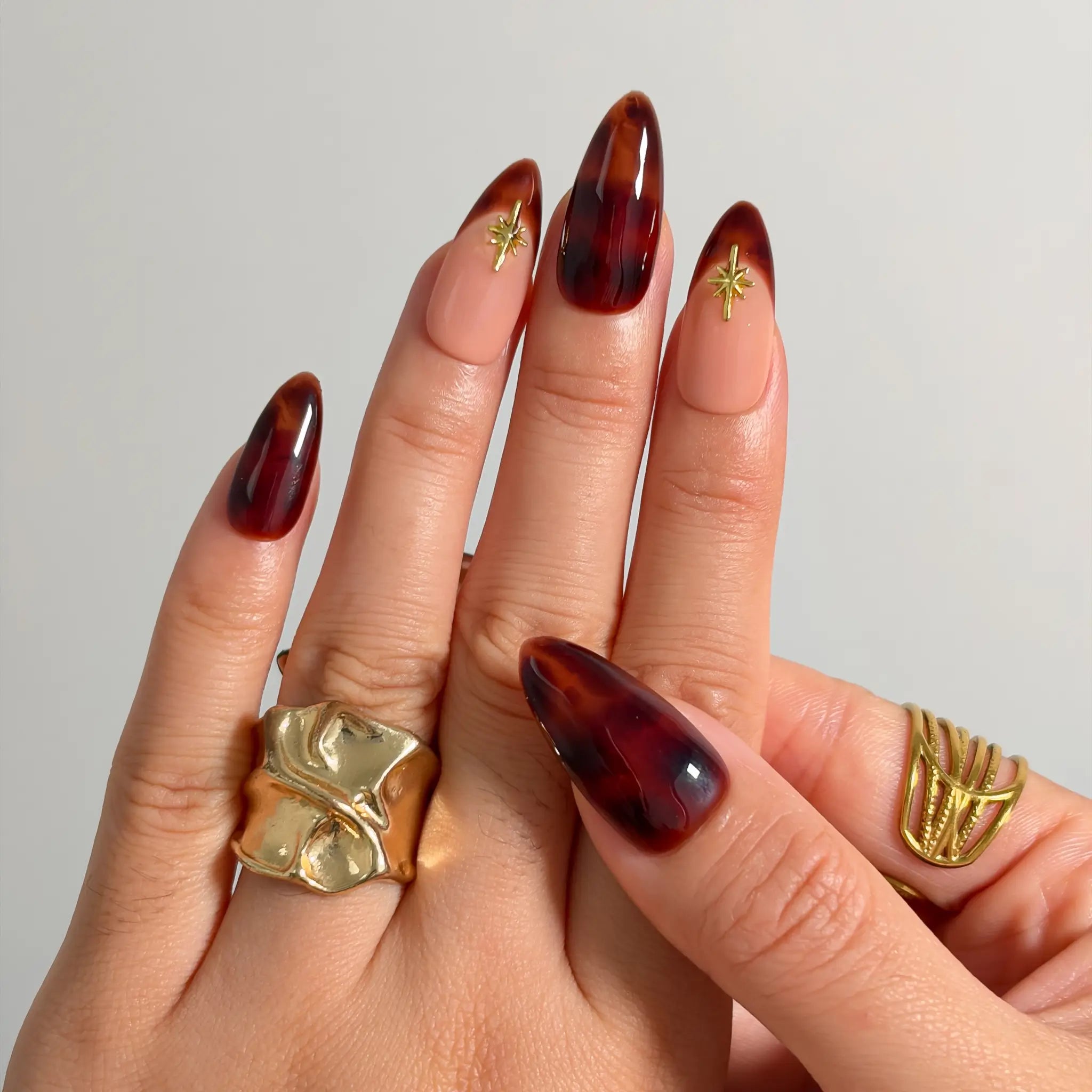 Tortoiseshell Golden Ember Long Almond press-on nails, modeled detail view 2