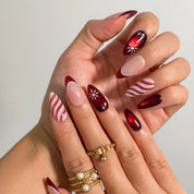 Crimson Peppermint Veil Long Almond press-on nails, modeled detail view 1