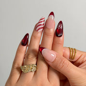 Crimson Peppermint Veil Long Almond press-on nails, modeled detail view 2