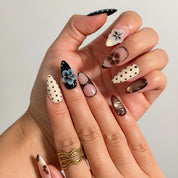 Noir Polka Bloom Long Almond press-on nails, modeled detail view 1