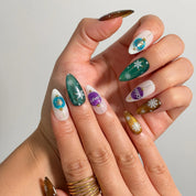 Ornament Snowfall Waltz Long Almond press-on nails, modeled detail view 1