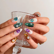 Ornament Snowfall Waltz Long Almond press-on nails, modeled detail view 2