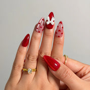 Crimson Heart Parade Long Almond press-on nails, modeled detail view 2