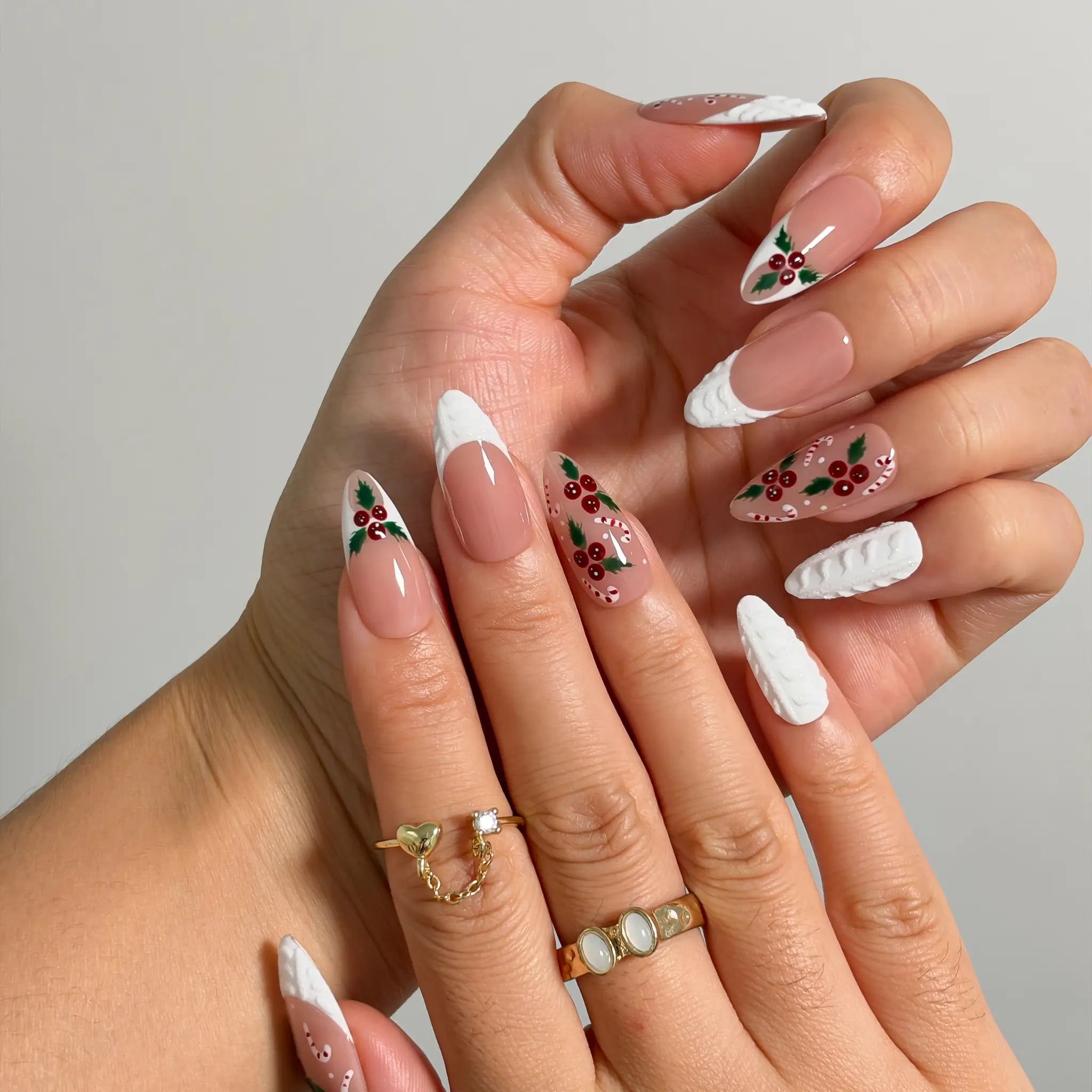 Candy Cane Snow Kiss Long Almond press-on nails, modeled detail view 1