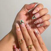 Yuletide Plaid Charm Long Almond press-on nails, modeled detail view 1