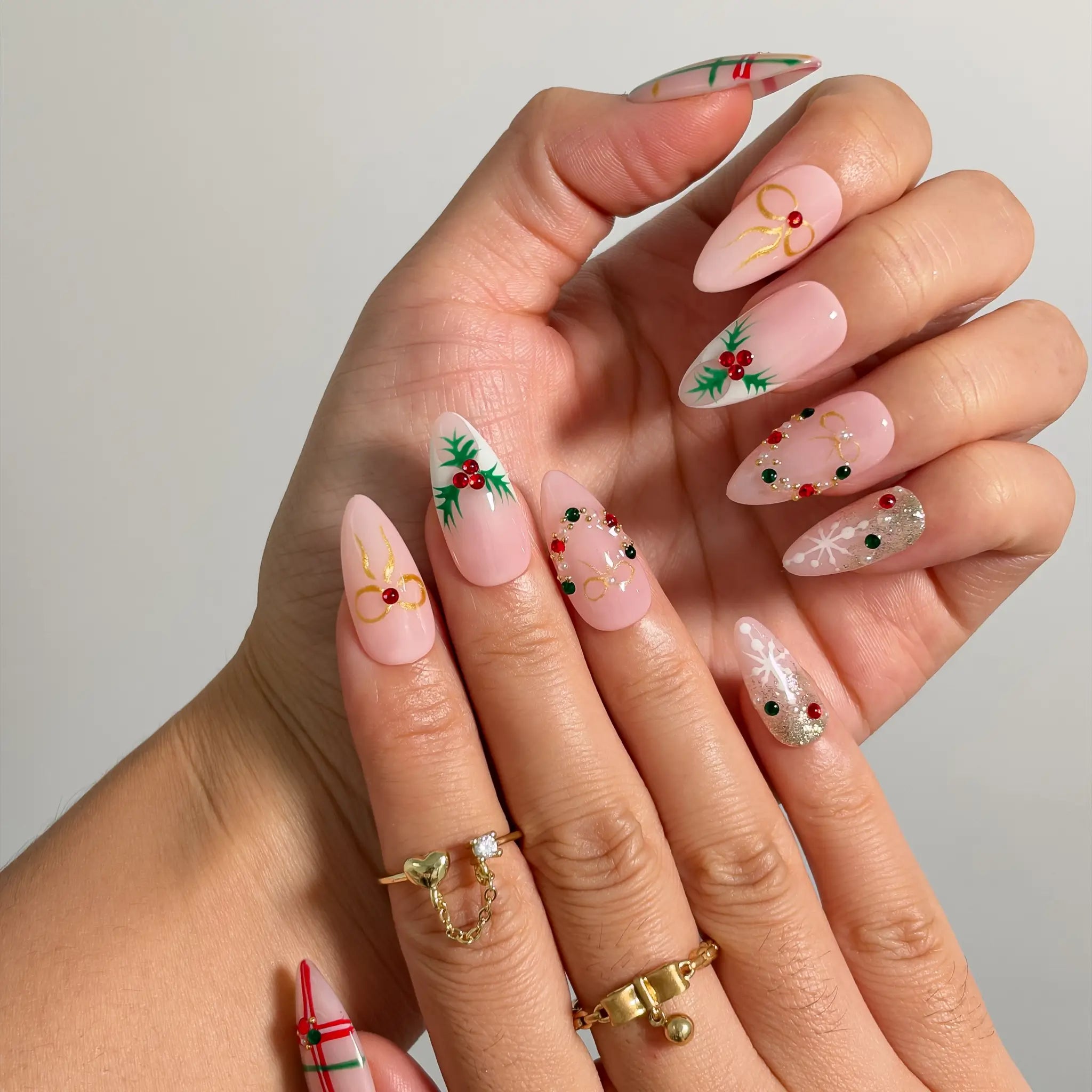 Yuletide Plaid Charm Long Almond press-on nails, modeled detail view 1