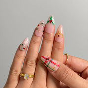 Yuletide Plaid Charm Long Almond press-on nails, modeled detail view 2