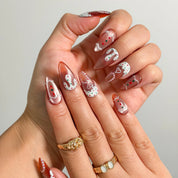 Gingerbread Frosting Dream Long Almond press-on nails, modeled detail view 1