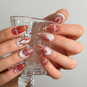 Gingerbread Frosting Dream Long Almond press-on nails, modeled detail view 2